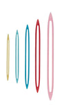 Set of colorful finishing needles with full-length eyes on a white background