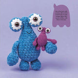 Crocheted blue creature with a smaller pink creature.