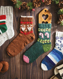Colorful knitted socks on a wooden surface with a list of sock patterns on the left.