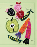 Collection of colorful crocheted food items on a green background with text indicating 'In the Kitchen'.