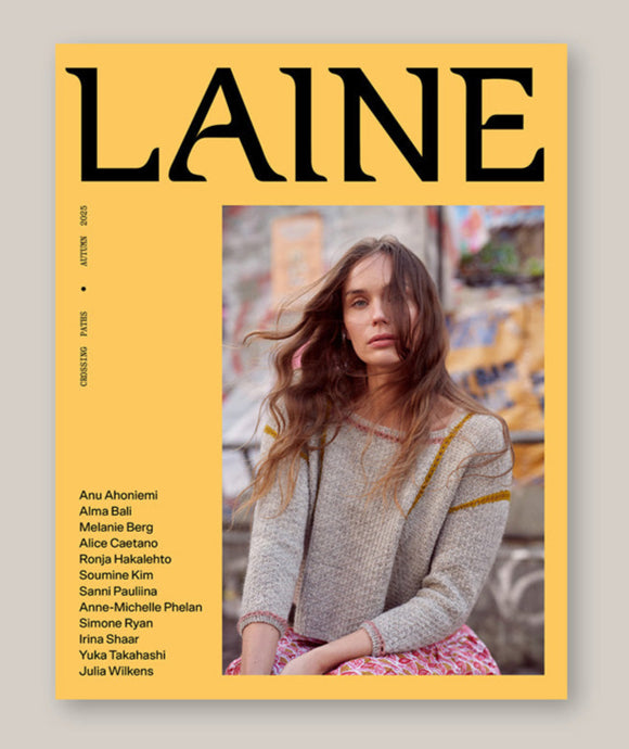 Magazine cover with 'Laine' branding and a person wearing a knitted sweater.