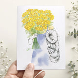 A card with a bouquet of yellow flowers and yarn skein illustration, surrounded by flowers.